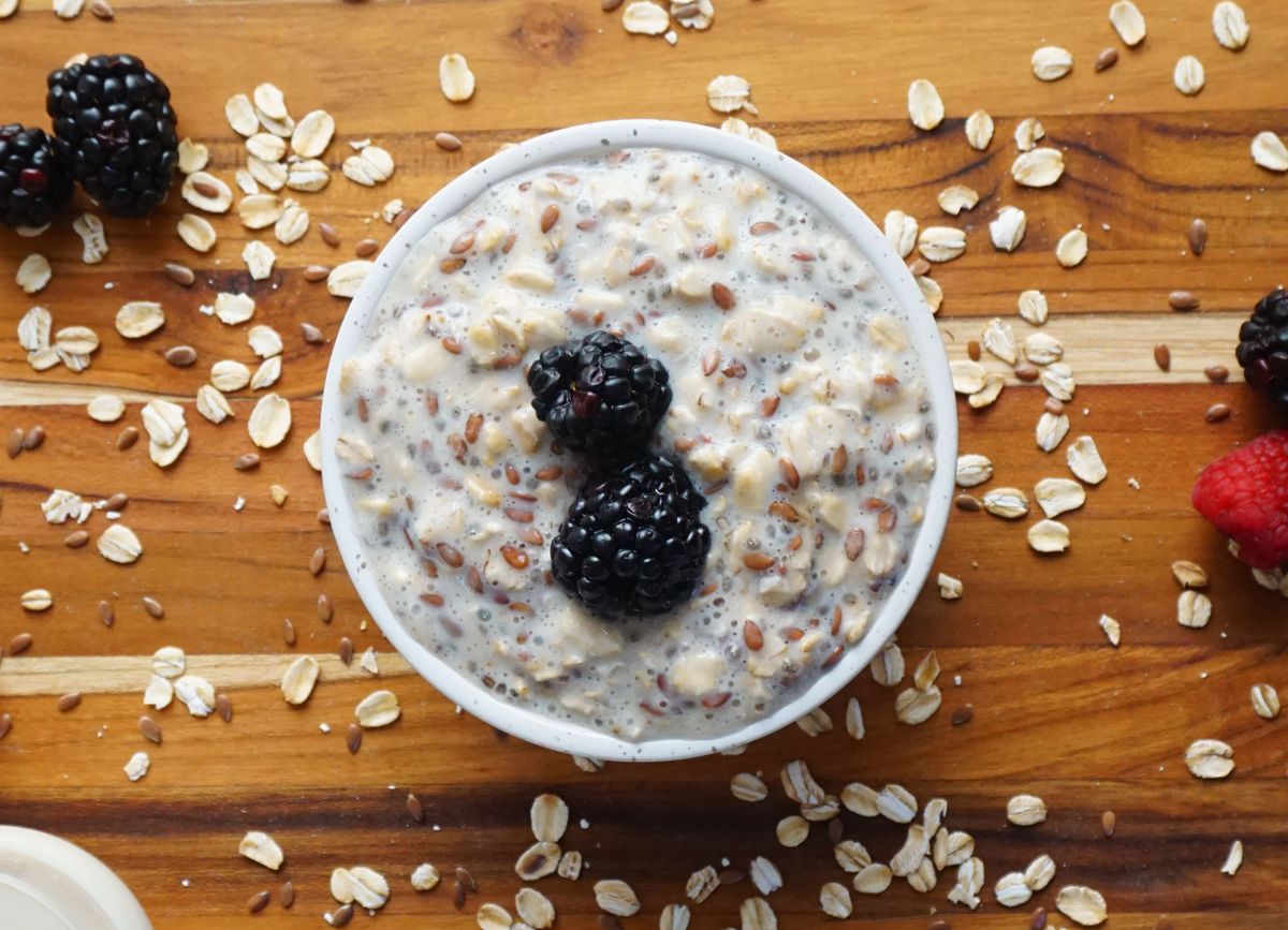 Overnight oats topped with blackberries and flax seeds.