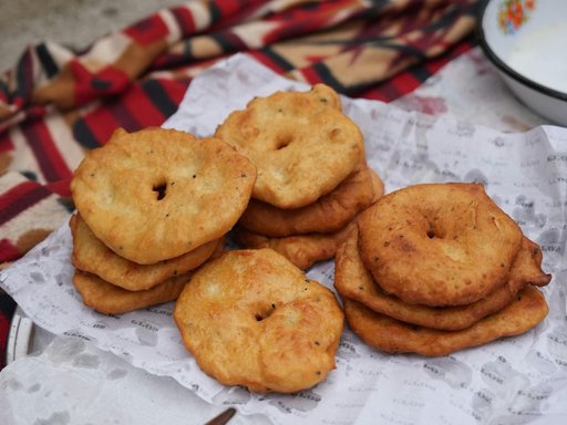 Traditional fried dough breads on paper