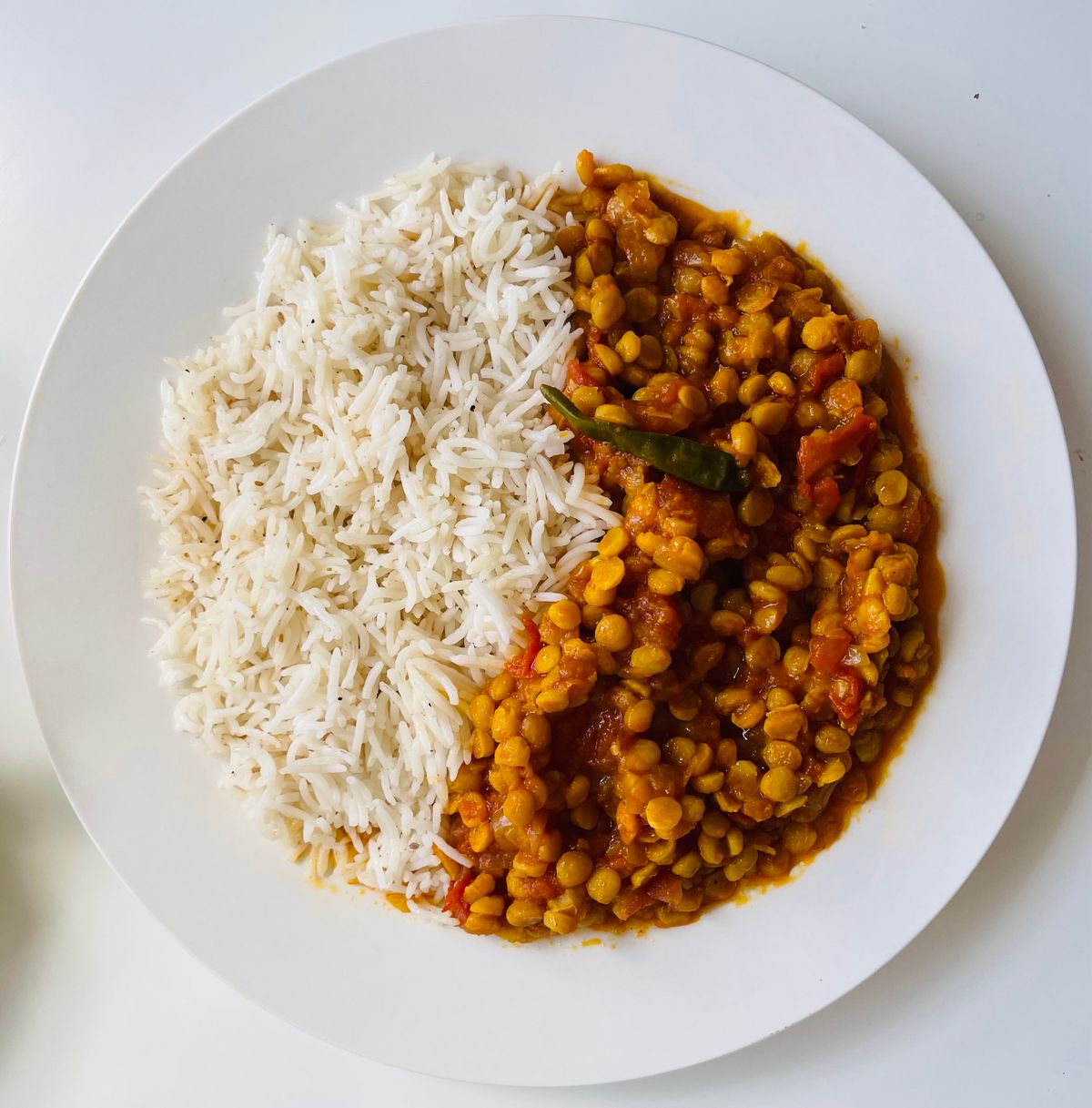 Aromatic lentil curry served with rice.
