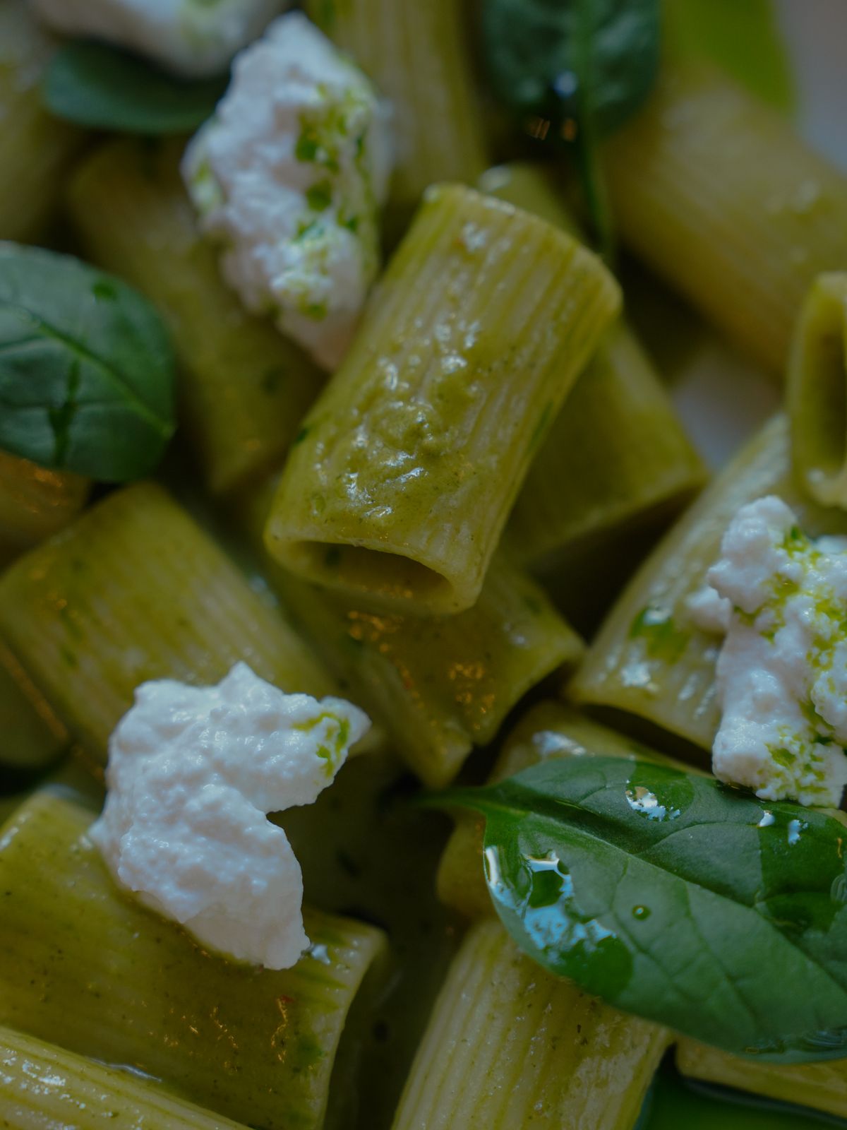 Green pasta with ricotta cheese and fresh spinach.