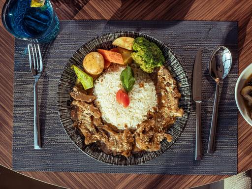 Beef stroganoff meal with rice and vegetables