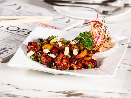 Kung Pao chicken served on a white plate
