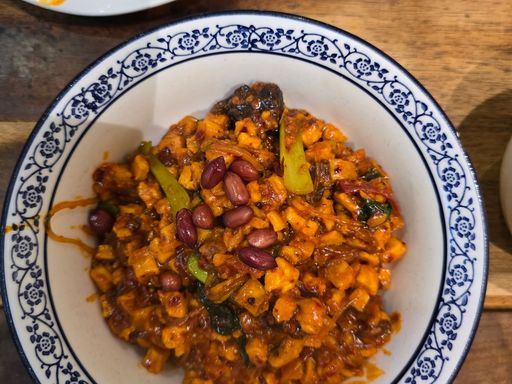 Spicy tofu and vegetable stir-fry in a bowl