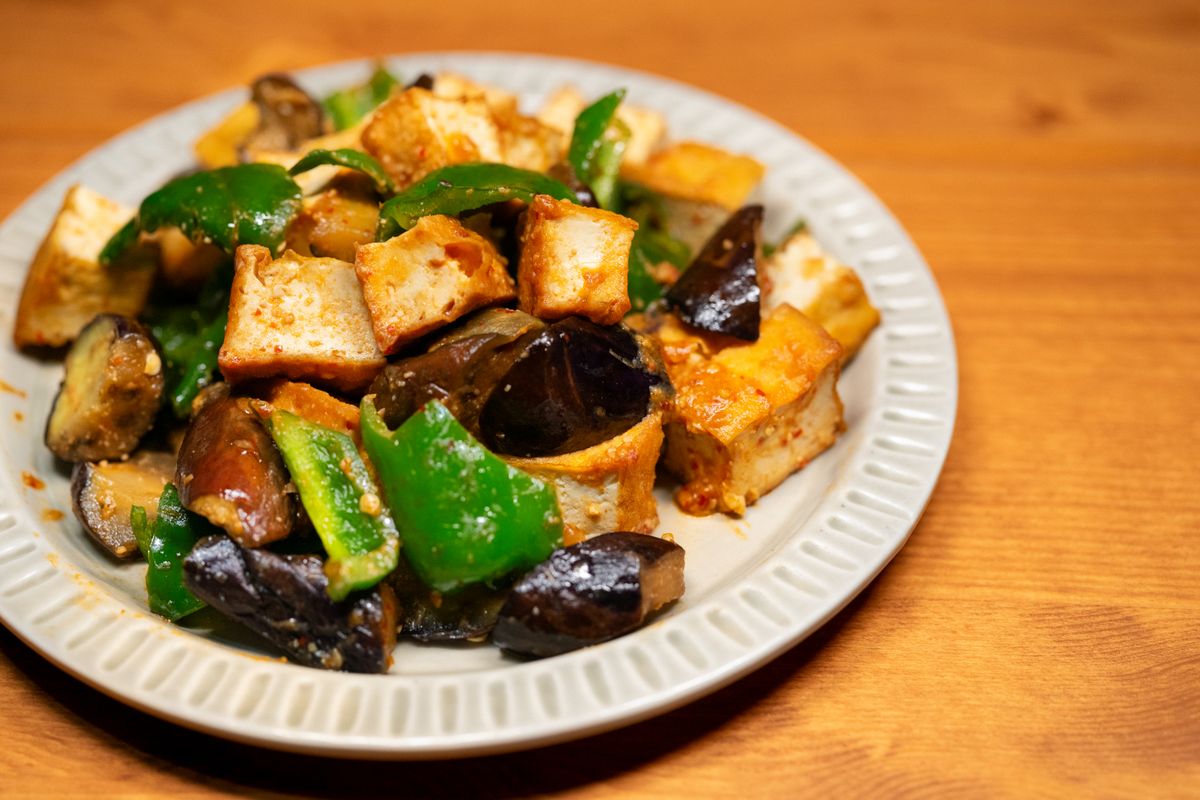 Stir-fried tofu with eggplant and bell peppers.