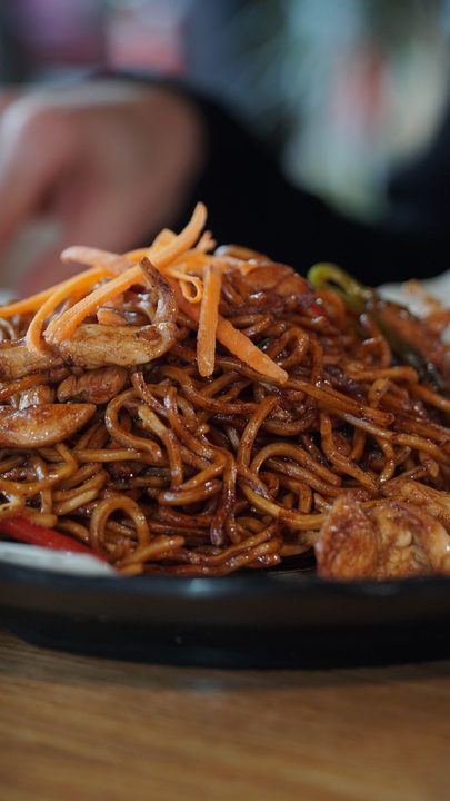 Tasty stir-fried noodles with chicken and fresh vegetables, perfect for Asian cuisine love