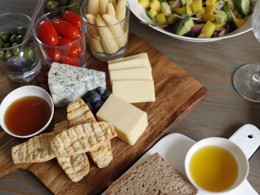 Cheese board with fresh salad and bread