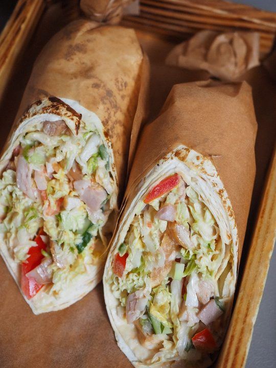 Tasty chicken wraps filled with fresh vegetables, perfect for a healthy lunch option.
