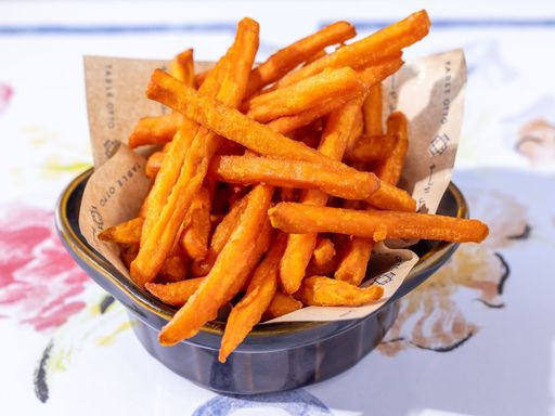 Crispy sweet potato fries served in a bowl