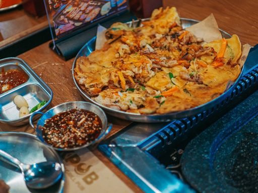 Korean pajeon served with dipping sauces.
