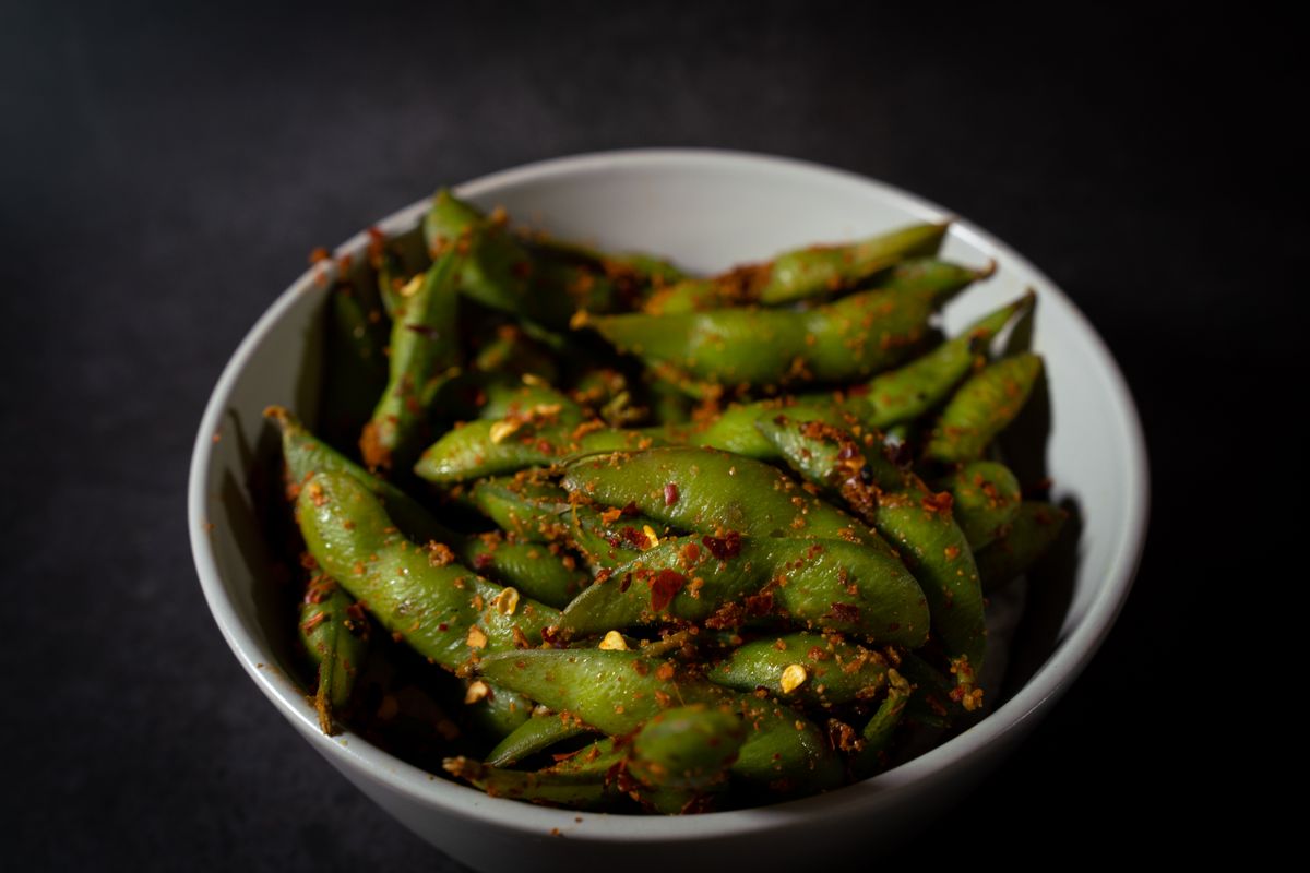 Spicy edamame beans served in a bowl.